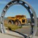 An exhibit at the Martha Gold Mine featuring a large gear and dump truck